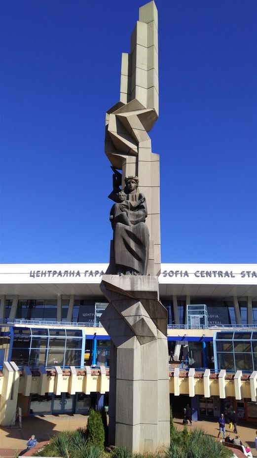 The mother & child Monument in front of the main building of the railway station.