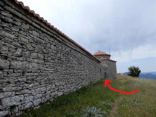 At the northern wall of old Voulkano there is a small opening covered with a wooden grid.  Enter at your own risk.