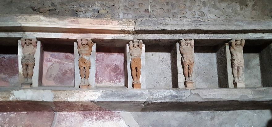 Male figures in terracotta (telamones) in Terme di Foro.