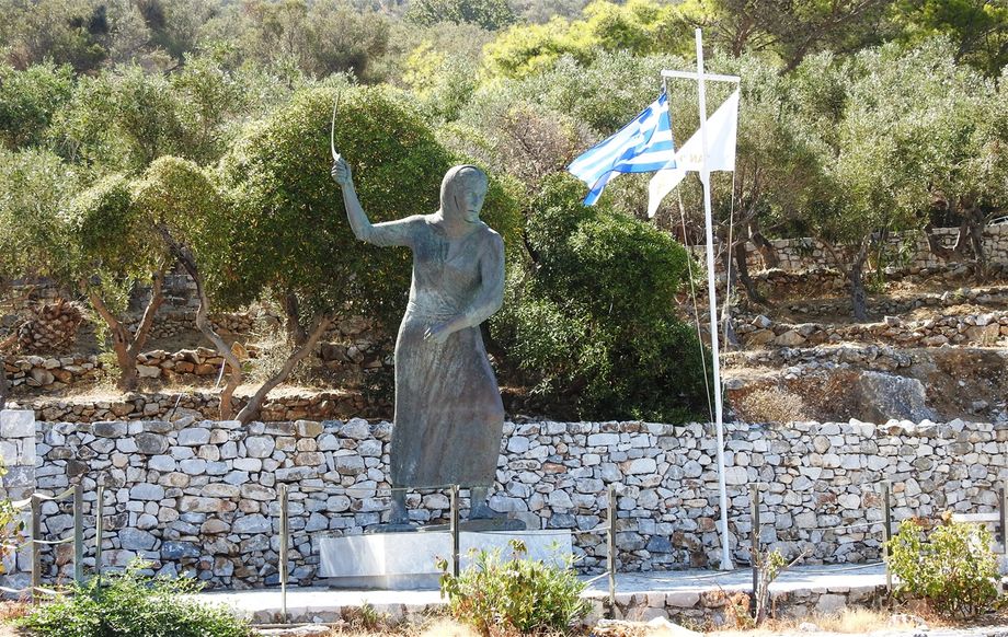 The memorial statue of the Woman of Mani located close to the entrance of Diros caves.  The women of Mani fought the Turks in the Battle of Diros in 1826 by any available means they had, such as sickles, stones and thistles. This is one of the most heroic aspects of modern Greek history.
