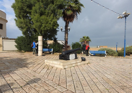 The cast-iron cannon and the monument of the Jewish settlement of Jaffa outside St. Peter's Church.