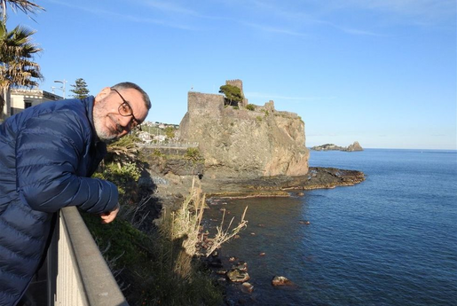Me and the castle of Aci Castello at the background.