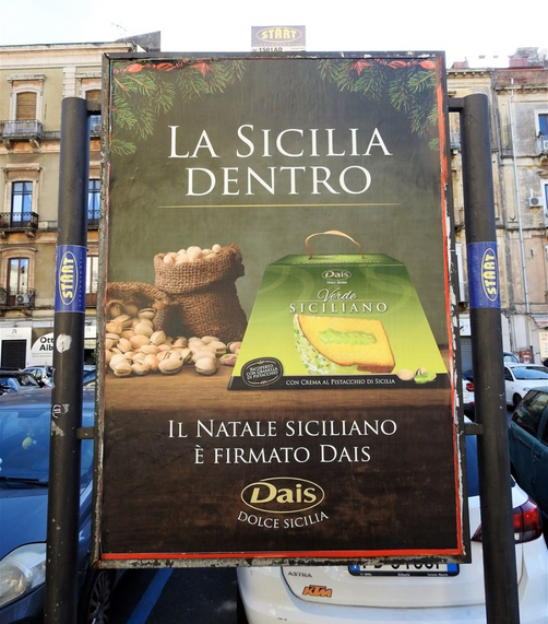 Xmas cake with pistachio cream. Street billboard in Catania.