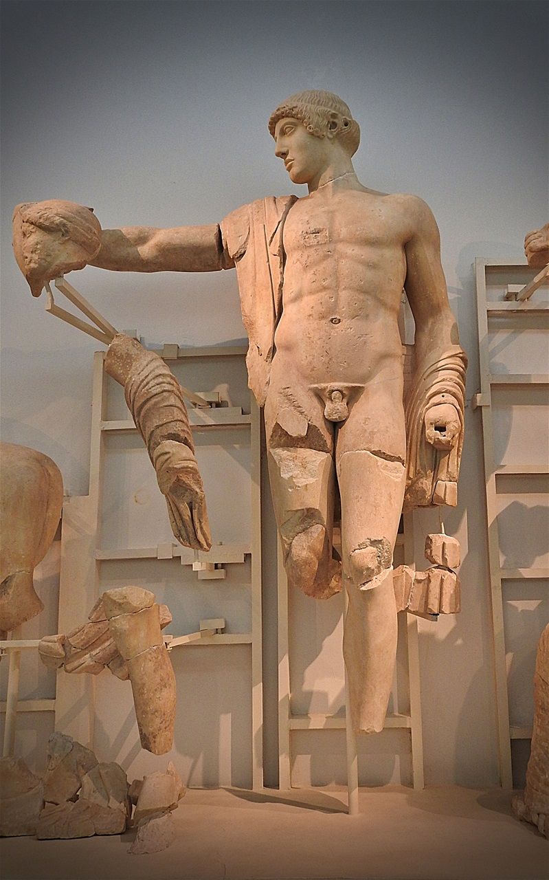 God Apollo is the central figure of the western pediment of the Temple of Zeus.