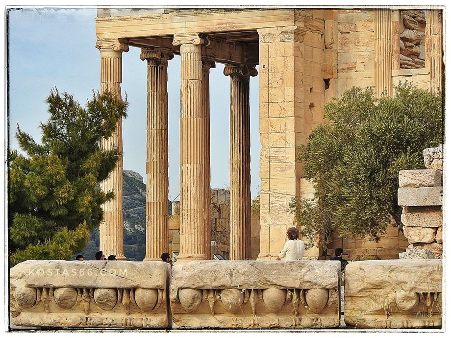 The Erechtheion.  The little olive tree on the right is where supposed to be the original tree goddess Athena donated to the city of Athens.