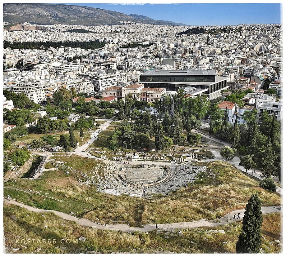 The Theater of Dionysus and the Acropolis museum seen from the sacred rock.
