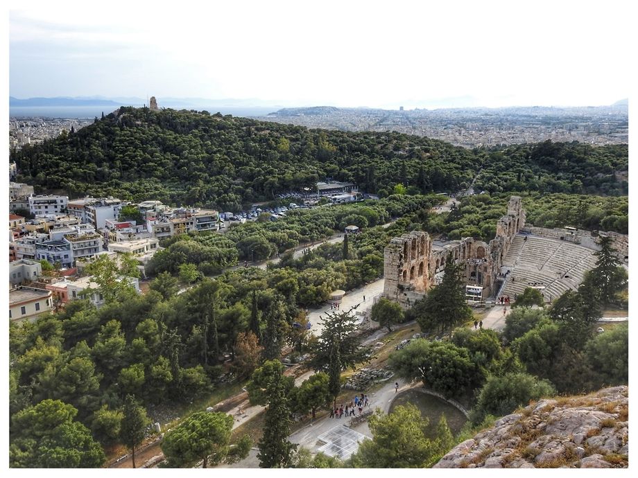 (South-east from the sacred hill). Filopappos Hill and its monument of the same name (left) and Odeon of Herodes Atticus (right).