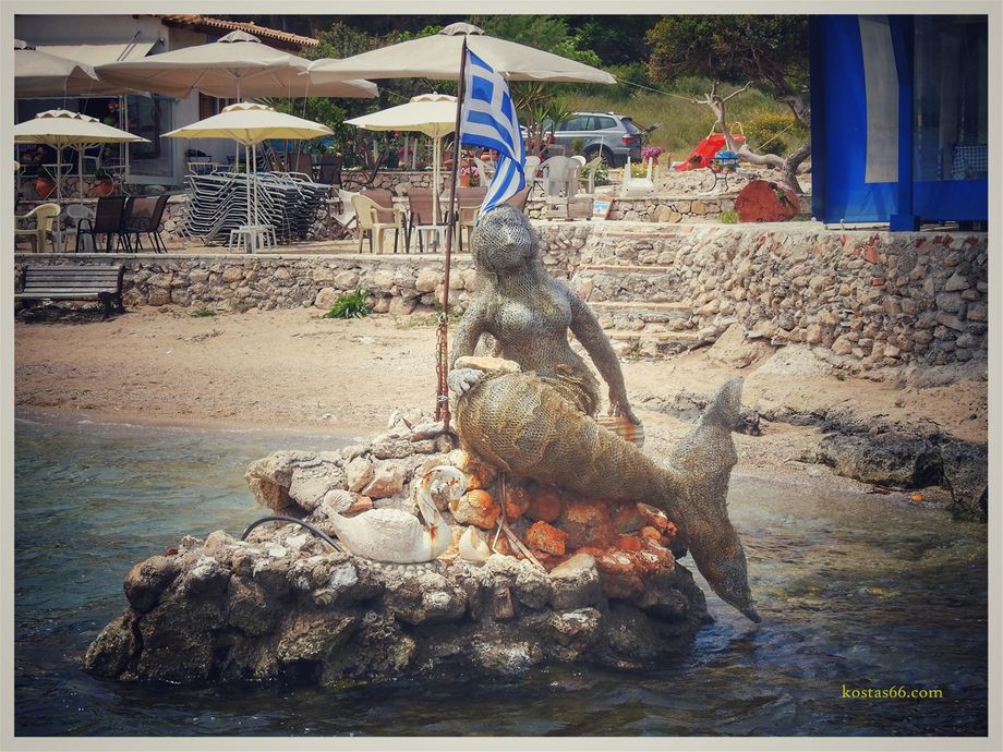 The tacky mermaid sculpture on the shores of Vouliagmeni Lake (north shore).