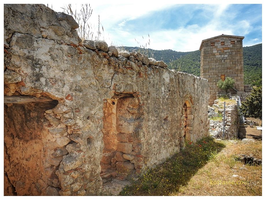 Remains of the cells of the old monastery (foreground) and the SE Tower (background).