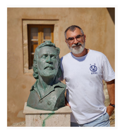 Me with Yannis Ritso's bust outside his house.