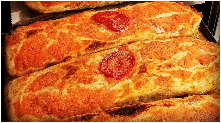 Sfincione (sfinciuni in Sicilian) is one of the most popular and traditional Sicilian pizzas, and the most popular street food.