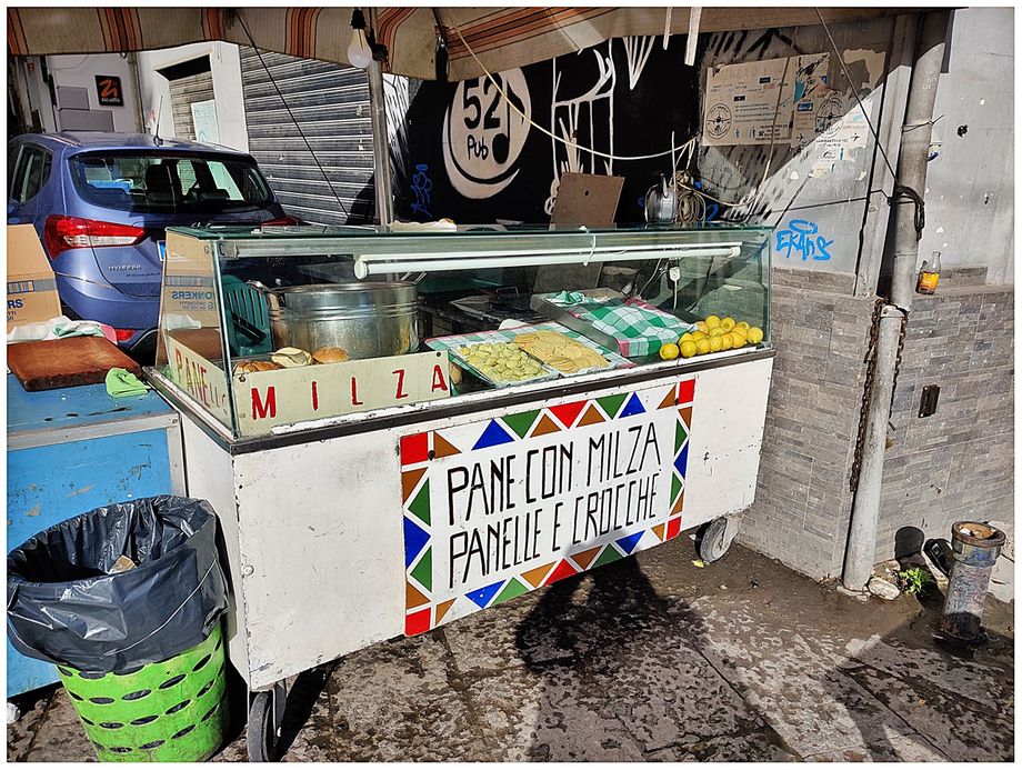 Street vendor selling milza, panelle and crocche at Ballaro Market.
