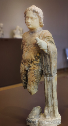 Statuette of a young boy.
